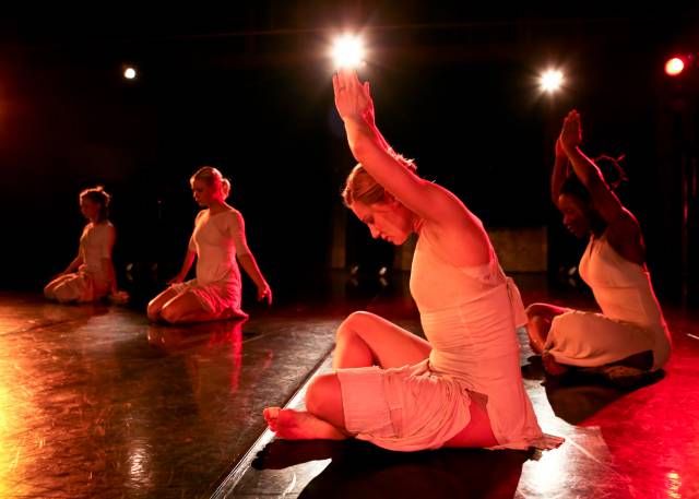 several women in meditative positions