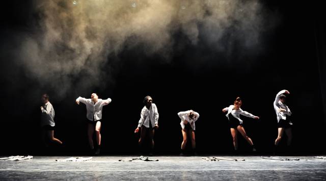 six bodies wearing white button downs and black shorts in various poses