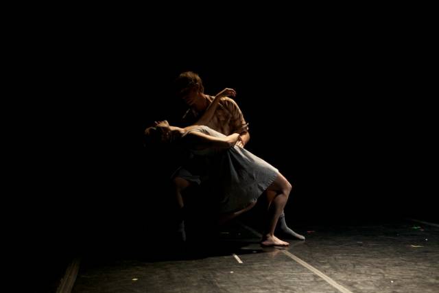 a man dips a woman backwards
