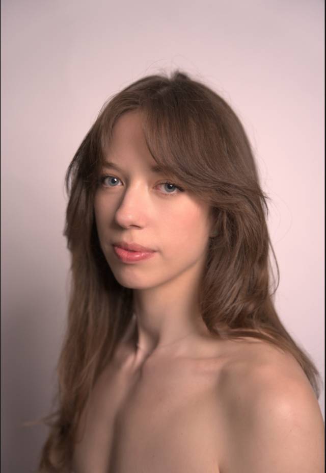 headshot of fair skinned woman with brown hair