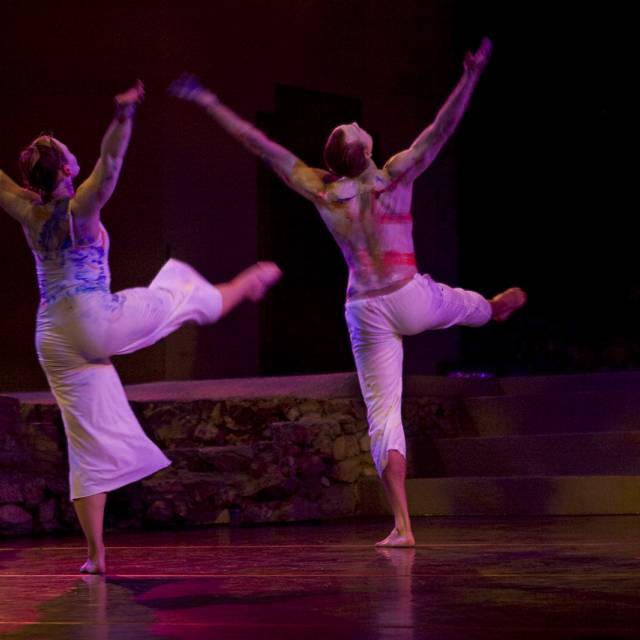 two people covered in paint dancing