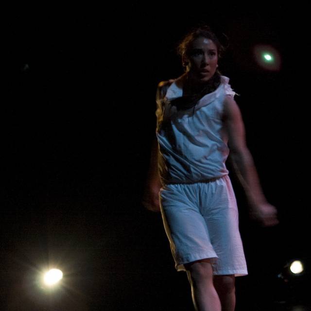 a figure wearing white in motion