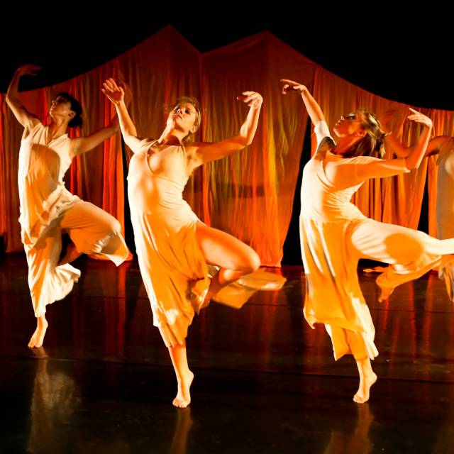 four women in passe while unfolding their arms