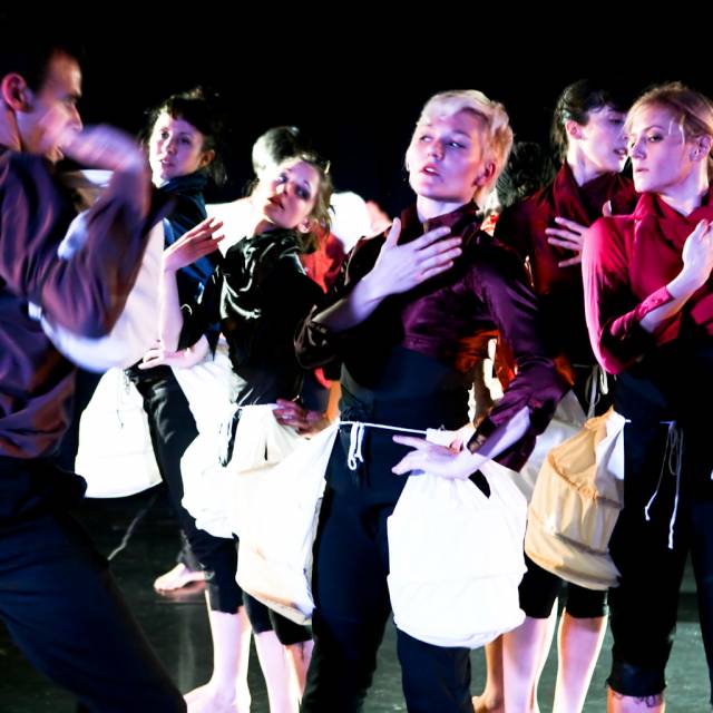 a group of figures fanning themselves 