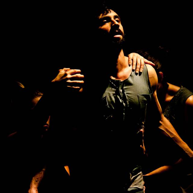 a man with mutliple hands grabbing his body