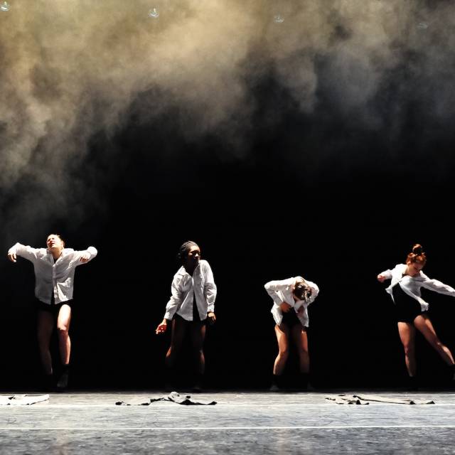 six bodies wearing white button downs and black shorts in various poses