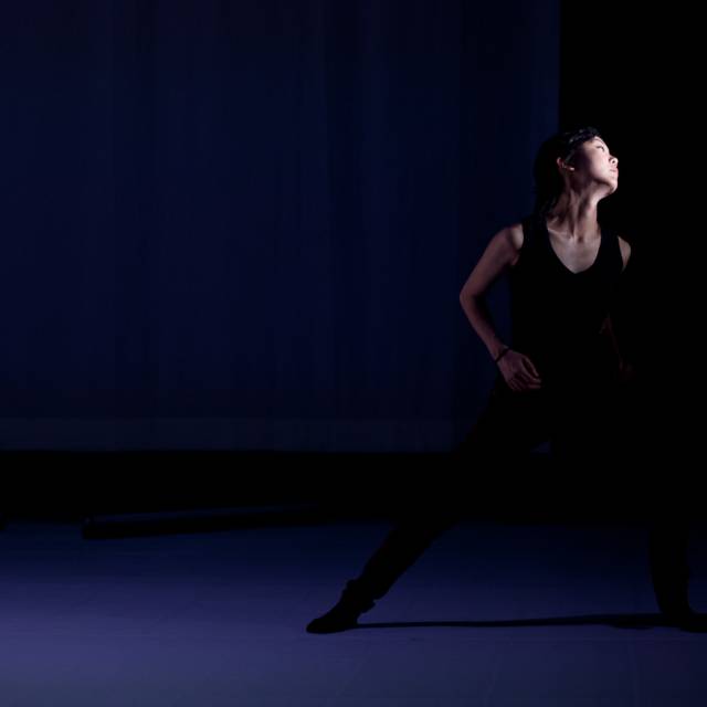 a woman leans to right while extending her leg