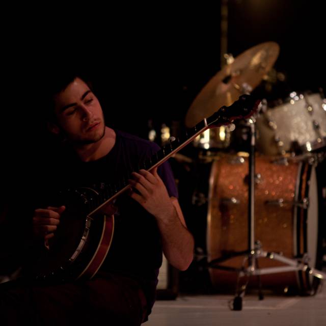 man plays banjo