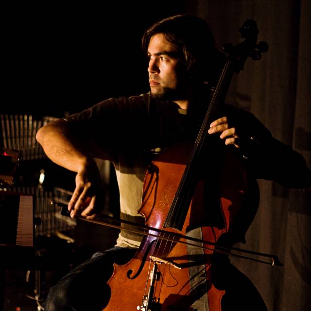 a man plays the cello