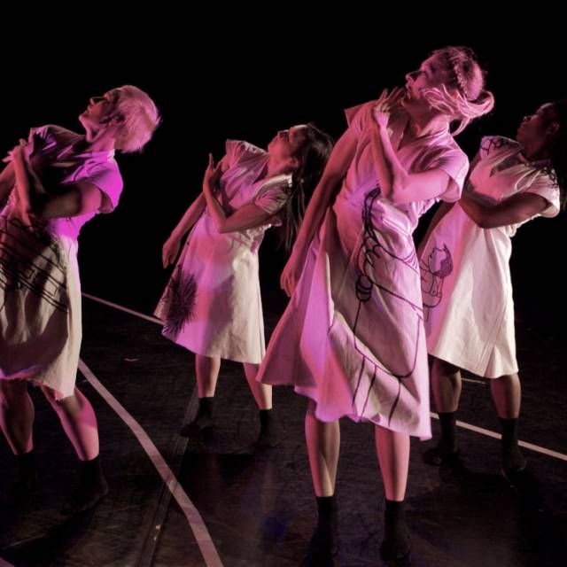 four women lean to the side 