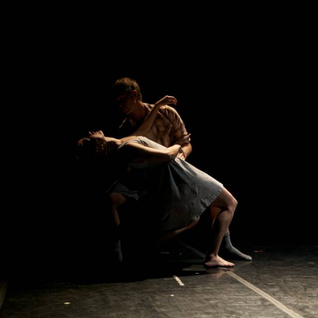 a man dips a woman backwards