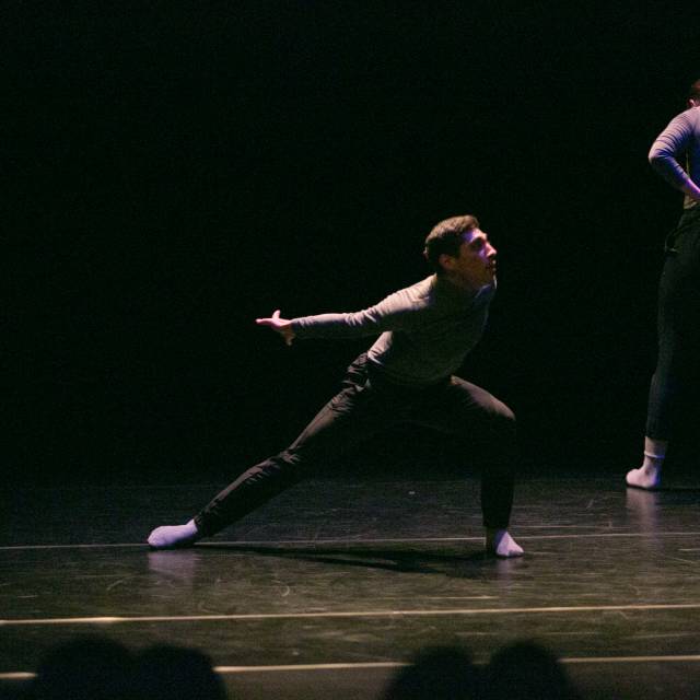 a man in a lunge with his arms flying back