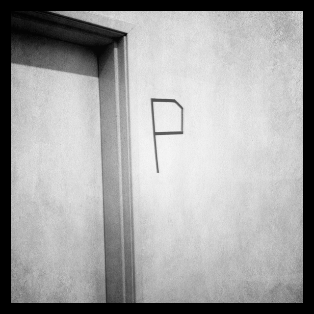 the letter "P" on a wall