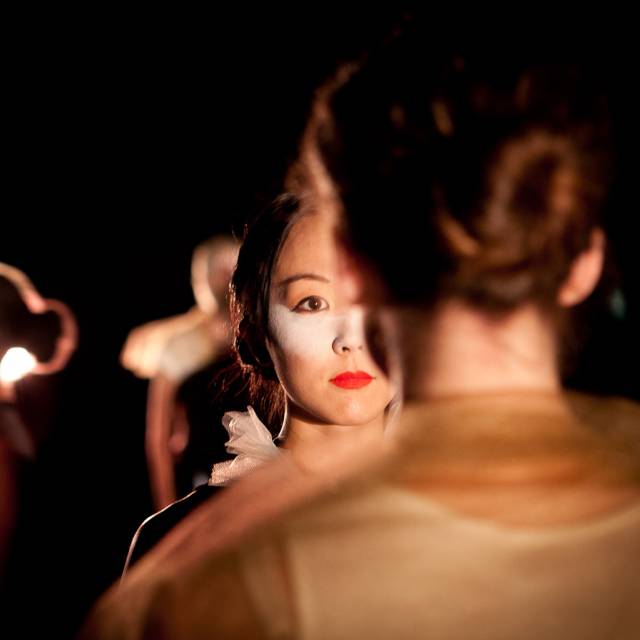 over the shoulder shot of a woman staring at another woman