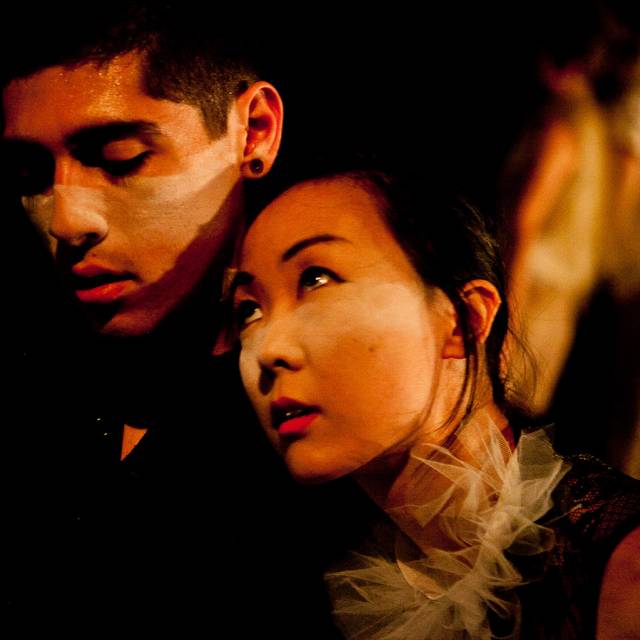 a woman leans on a man's shoulder