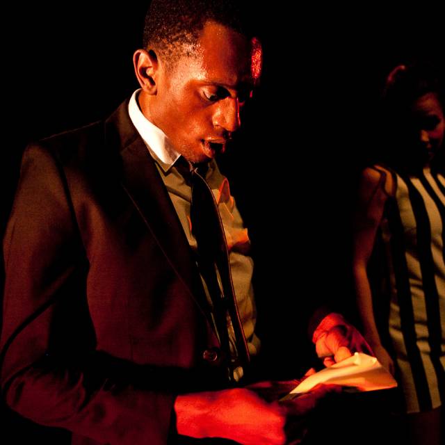 a man stares in awe at a piece of paper