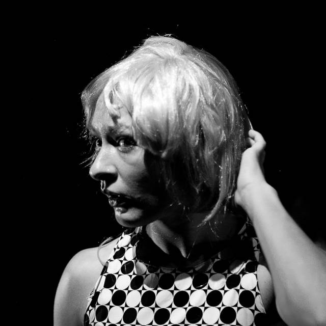 a woman touches her wig