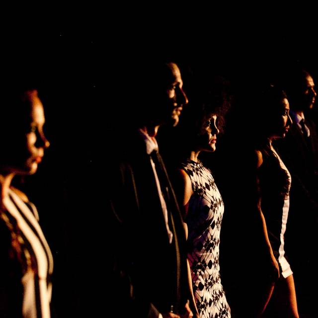 a group of people in profile staring outward