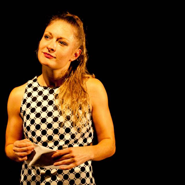a woman holds a letter