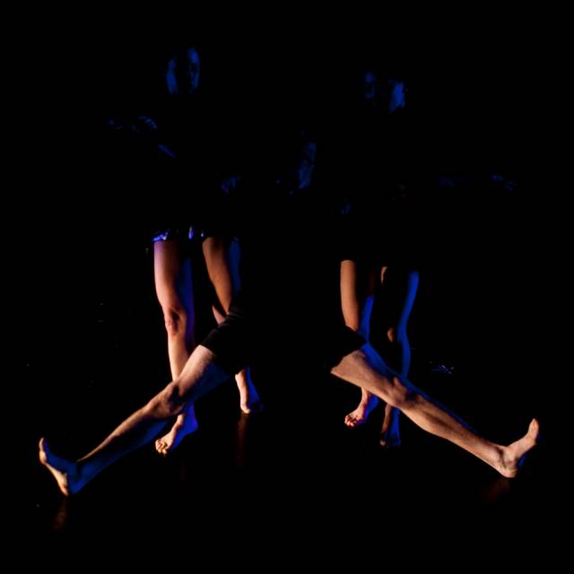 legs extend out from the darkness