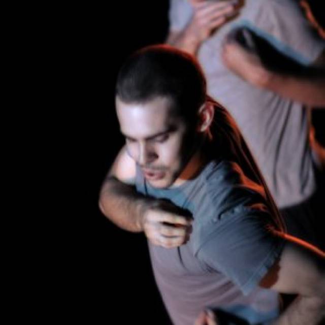 two men grab their shoulder