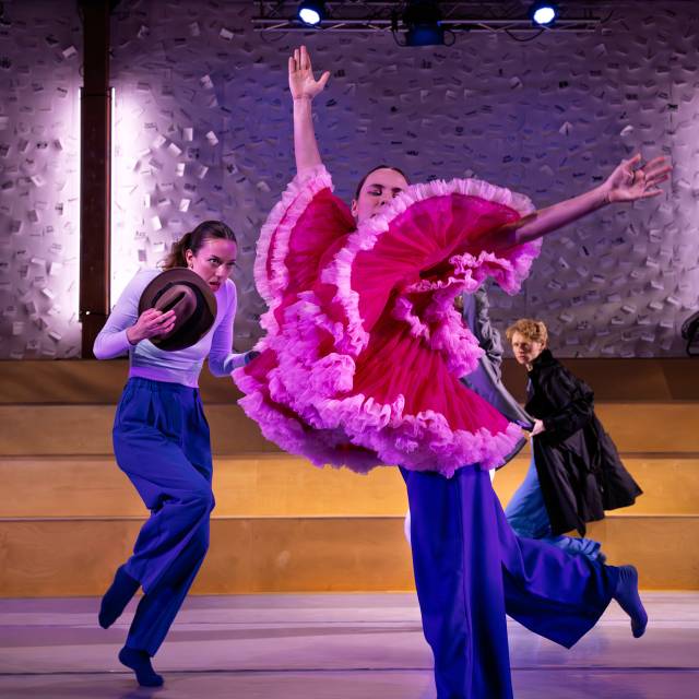 dancers play with props.